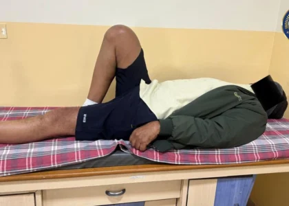 A man sleep on the bed after knee replacement